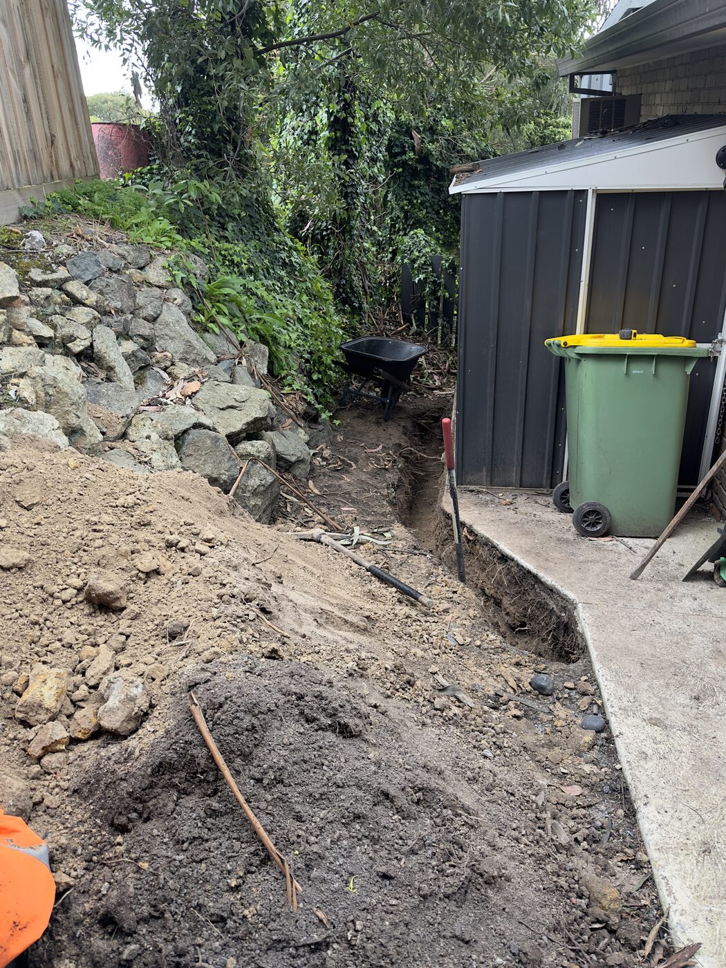 Manual trenching in tight access backyard